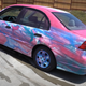 Image for article titled Heroes Respray Honda Civic Using A Giant Dumpster Full Of Paint